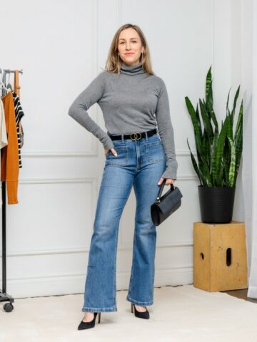 Woman wearing flare jeans with pointed toe ankle boots for fall/winter.