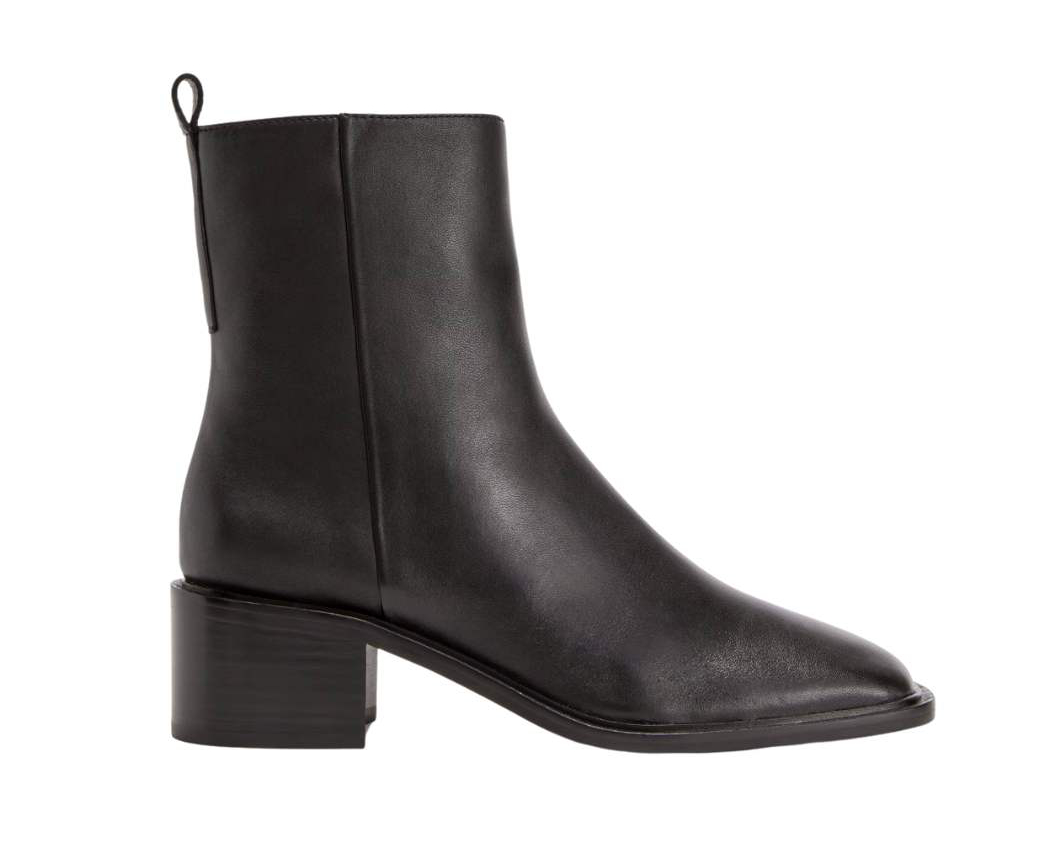 Black block heel ankle boot on a white backgrou.d