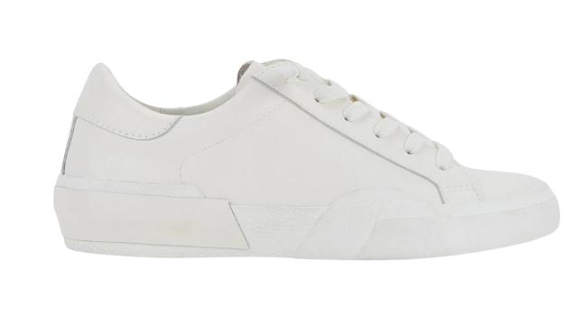 White lace up sneaker for women on a white background.